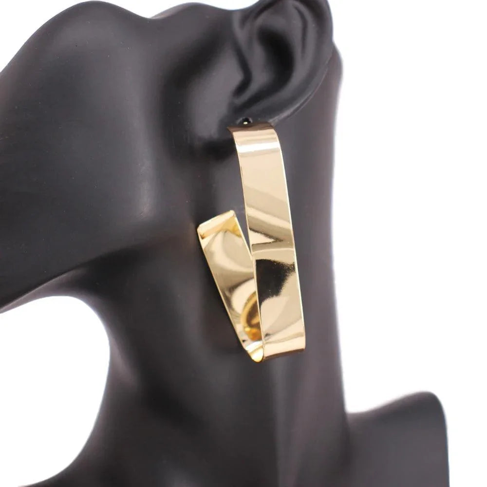 Gold Wavy Metal Oval Hoop Earrings - Jewelry Store by Erik Rayo