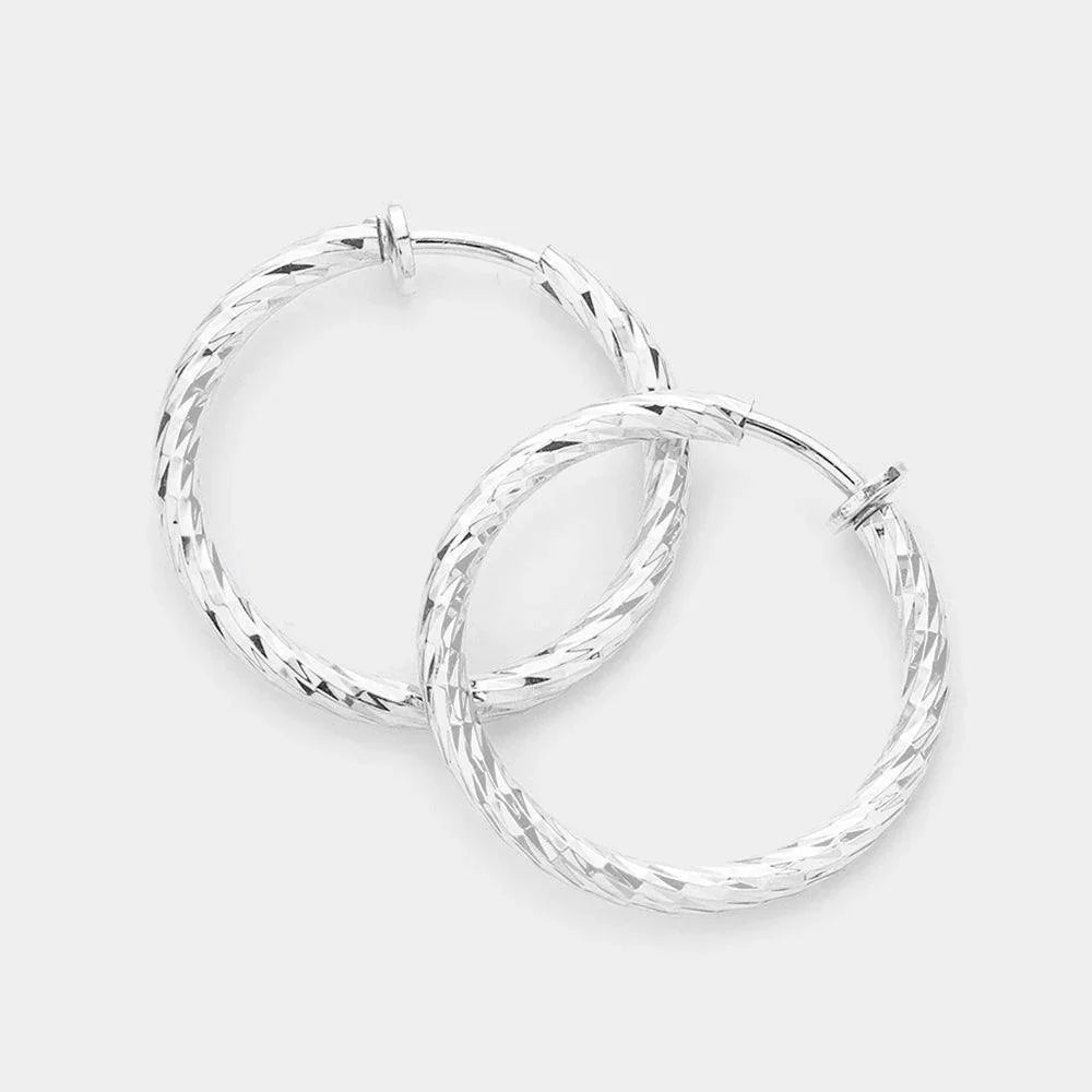 Silver 1.25" Textured metal hoop clip on earrings - Jewelry Store by Erik Rayo
