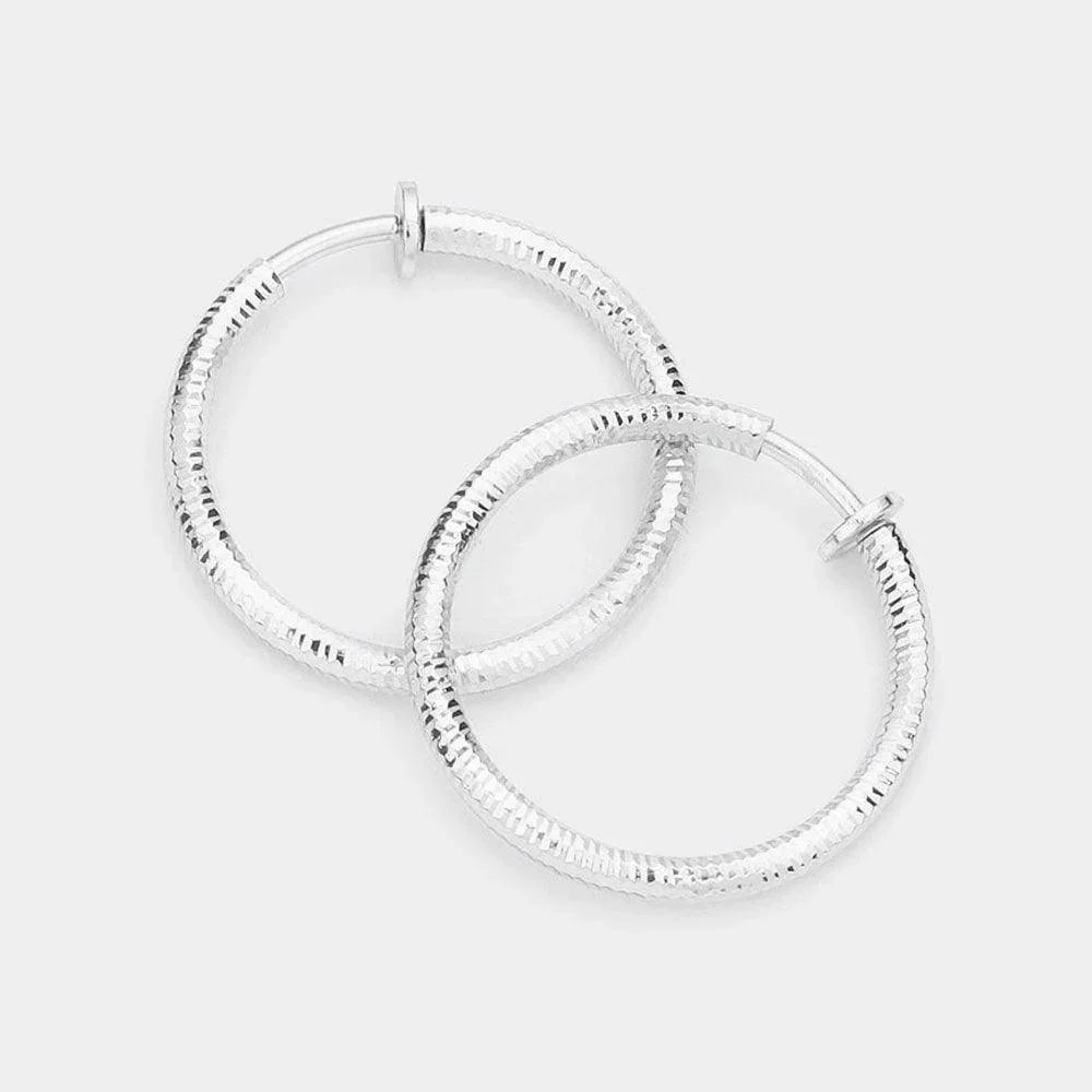 Silver 1.25 Inch Textured Metal Clip On Hoop Earrings - Jewelry Store by Erik Rayo