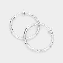 Load image into Gallery viewer, Silver 1.25 Inch Textured Metal Clip On Hoop Earrings
