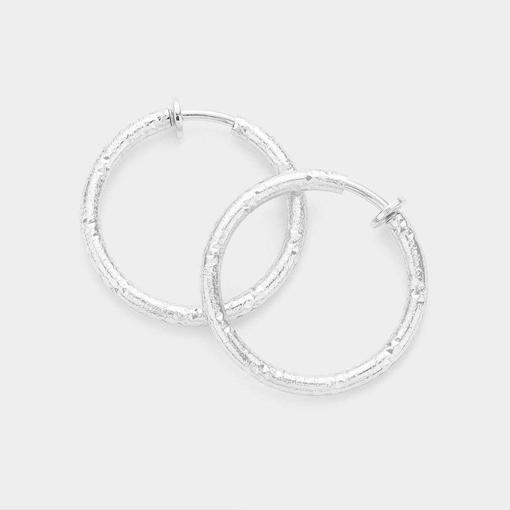 Silver 1.25 Inch Textured Metal Hoop Clip On Earrings - Jewelry Store by Erik Rayo