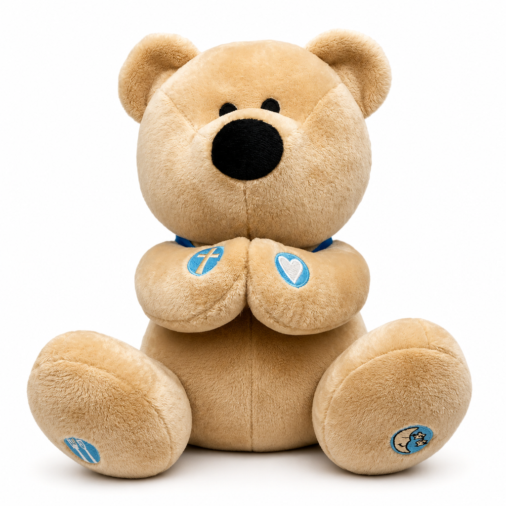A plush teddy bear toy in light tan with a black nose and eyes, sitting against a plain white background. The bear has small blue embroidered patches on its paws and feet.