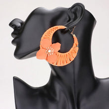 Load image into Gallery viewer, Orange Flower Accented Raffia Wrapped Hoop Earrings
