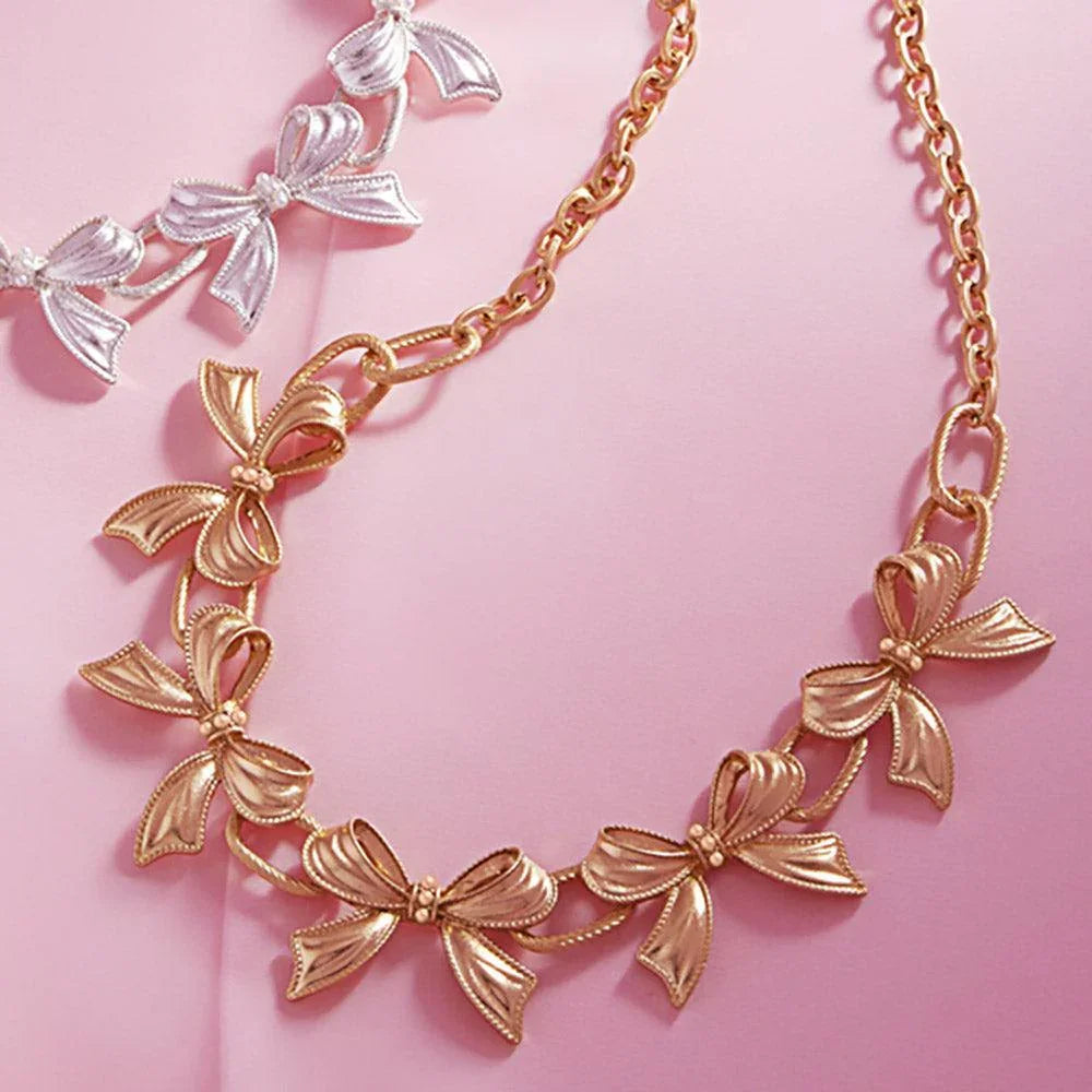 Gold Pearl Pointed Metal Bow Link Necklace - Jewelry Store by Erik Rayo
