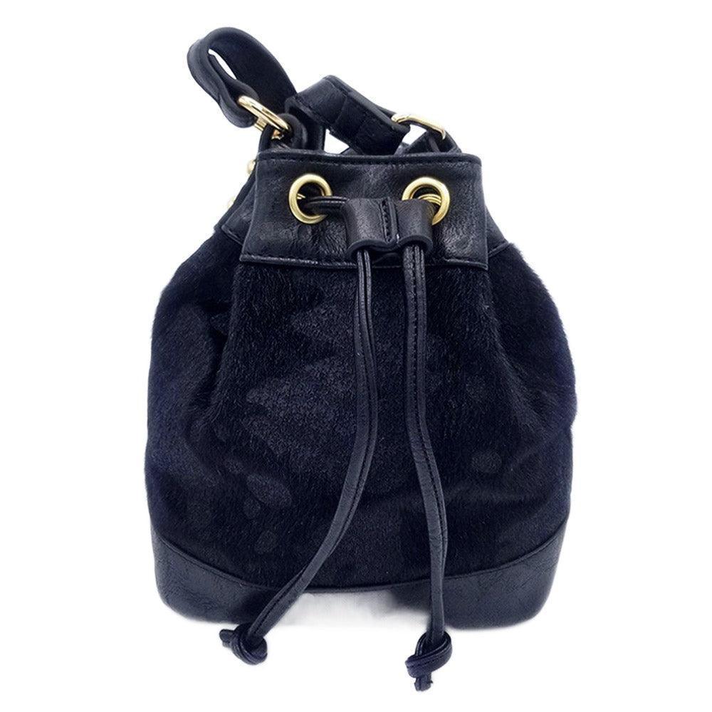 Cow Patterned Faux Leather Drawstring Crossbody Bag - Jewelry Store by Erik Rayo