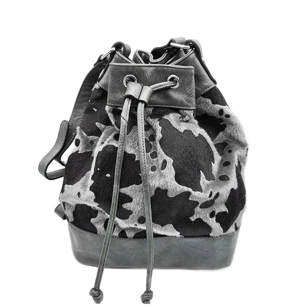 Cow Patterned Faux Leather Drawstring Crossbody Bag - Jewelry Store by Erik Rayo