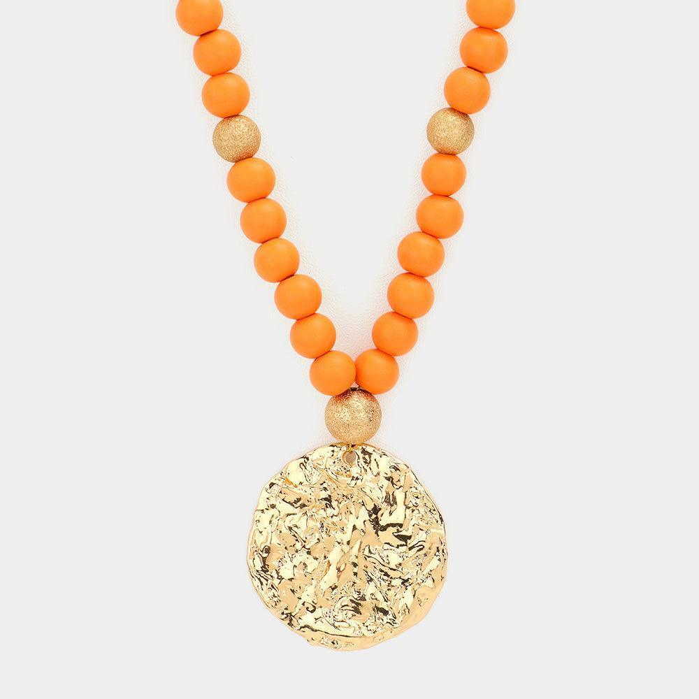 Orange Hammered Metal Round Pendant Wood Beaded Long Necklace - Jewelry Store by Erik Rayo