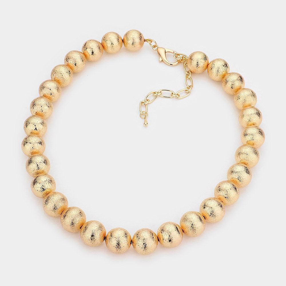 Gold Metal Ball Necklace - Jewelry Store by Erik Rayo