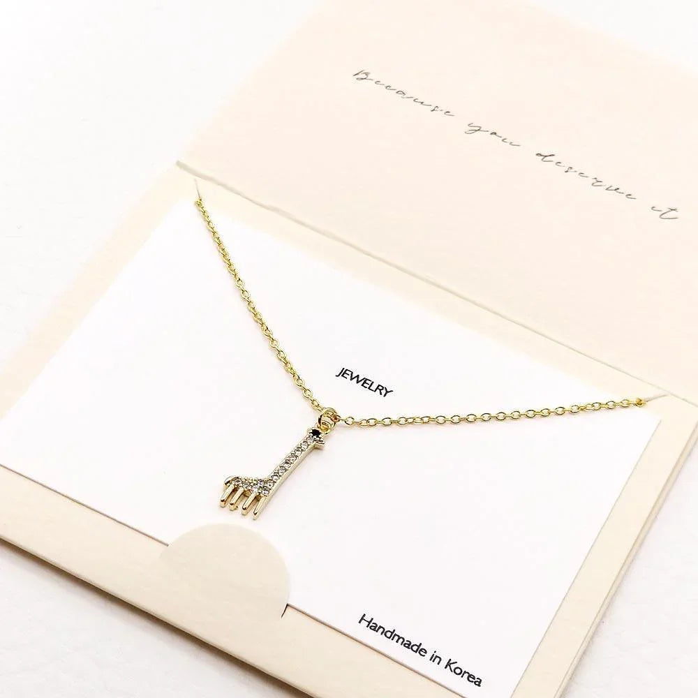 Gold Rhinestone Embellished Metal Giraffe Pendant Necklace - Jewelry Store by Erik Rayo