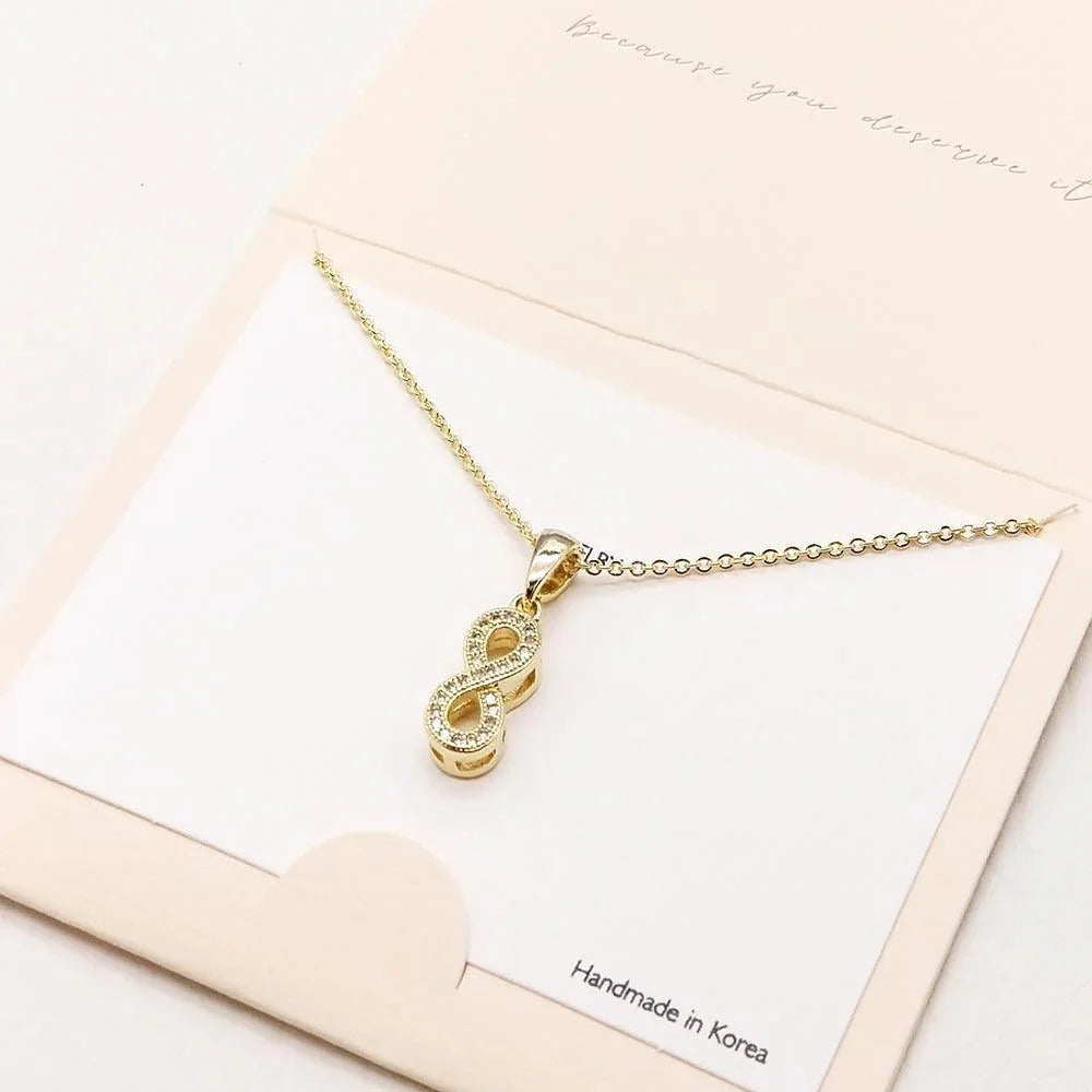 Gold CZ Embellished Infinity Pendant Necklace - Jewelry Store by Erik Rayo