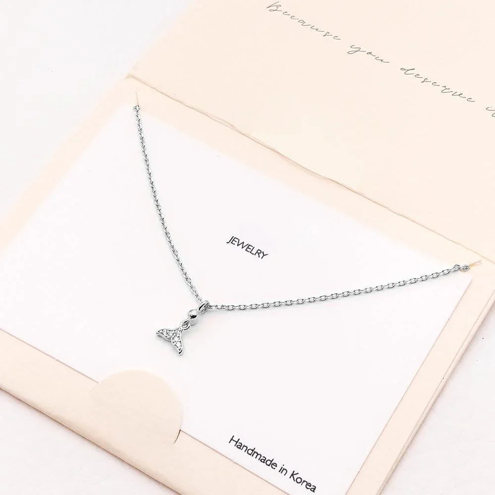 Silver CZ Embellished Whale Tail Pendant Necklace - Jewelry Store by Erik Rayo