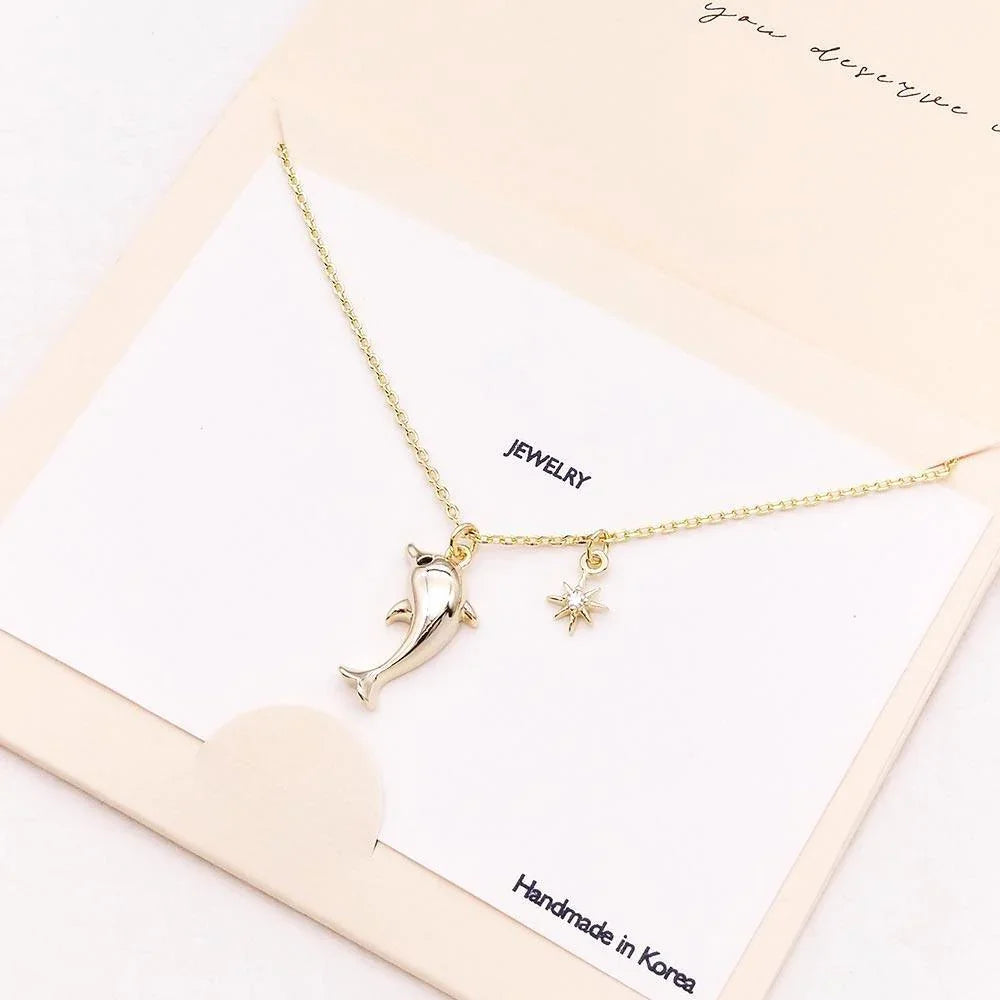 Gold CZ Embellished Dolphin North Star Pendant Necklace - Jewelry Store by Erik Rayo