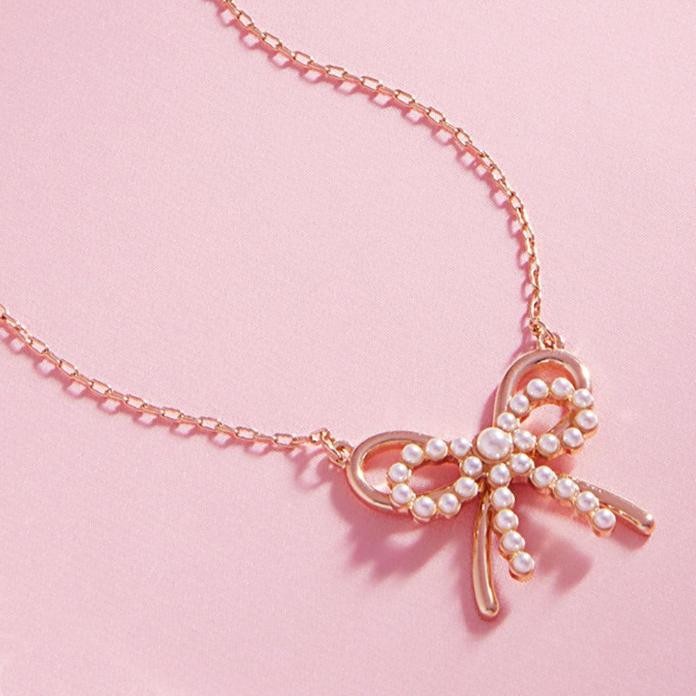 Cream Pearl Metal Bow Pendant Necklace - Jewelry Store by Erik Rayo