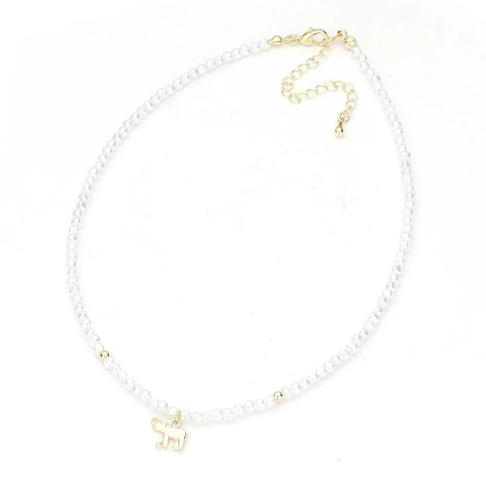 Cream Metal Elephant Pendant Pearl Necklace - Jewelry Store by Erik Rayo