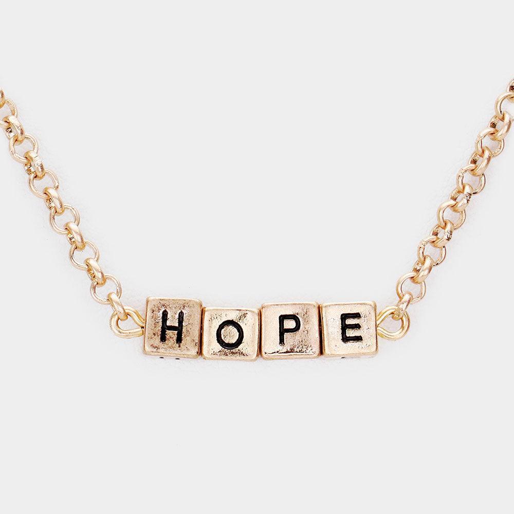 Gold HOPE Metal Cube Pendant Necklace - Jewelry Store by Erik Rayo