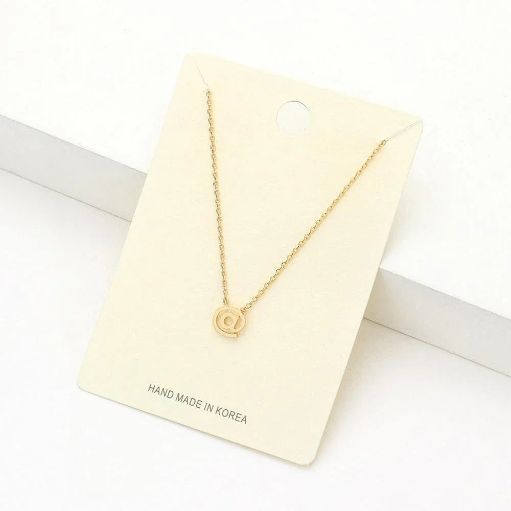 Gold Textured Matte Metal AT Symbol Pendant Necklace - Jewelry Store by Erik Rayo