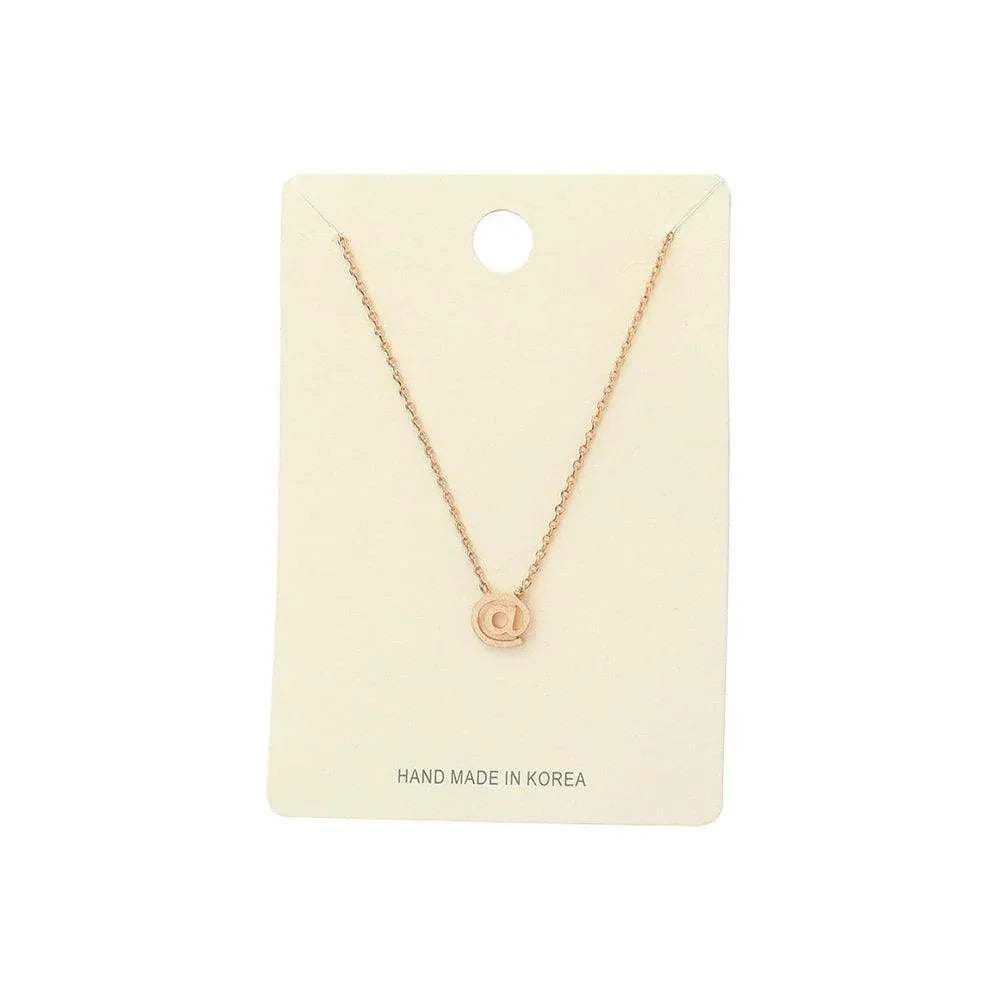 Rose Gold Textured Matte Metal AT Symbol Pendant Necklace - Jewelry Store by Erik Rayo