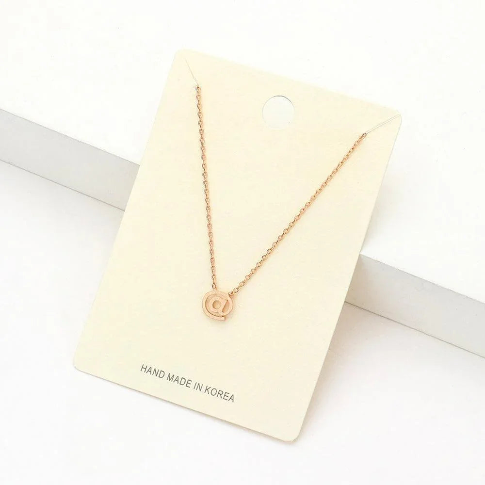 Rose Gold Textured Matte Metal AT Symbol Pendant Necklace - Jewelry Store by Erik Rayo