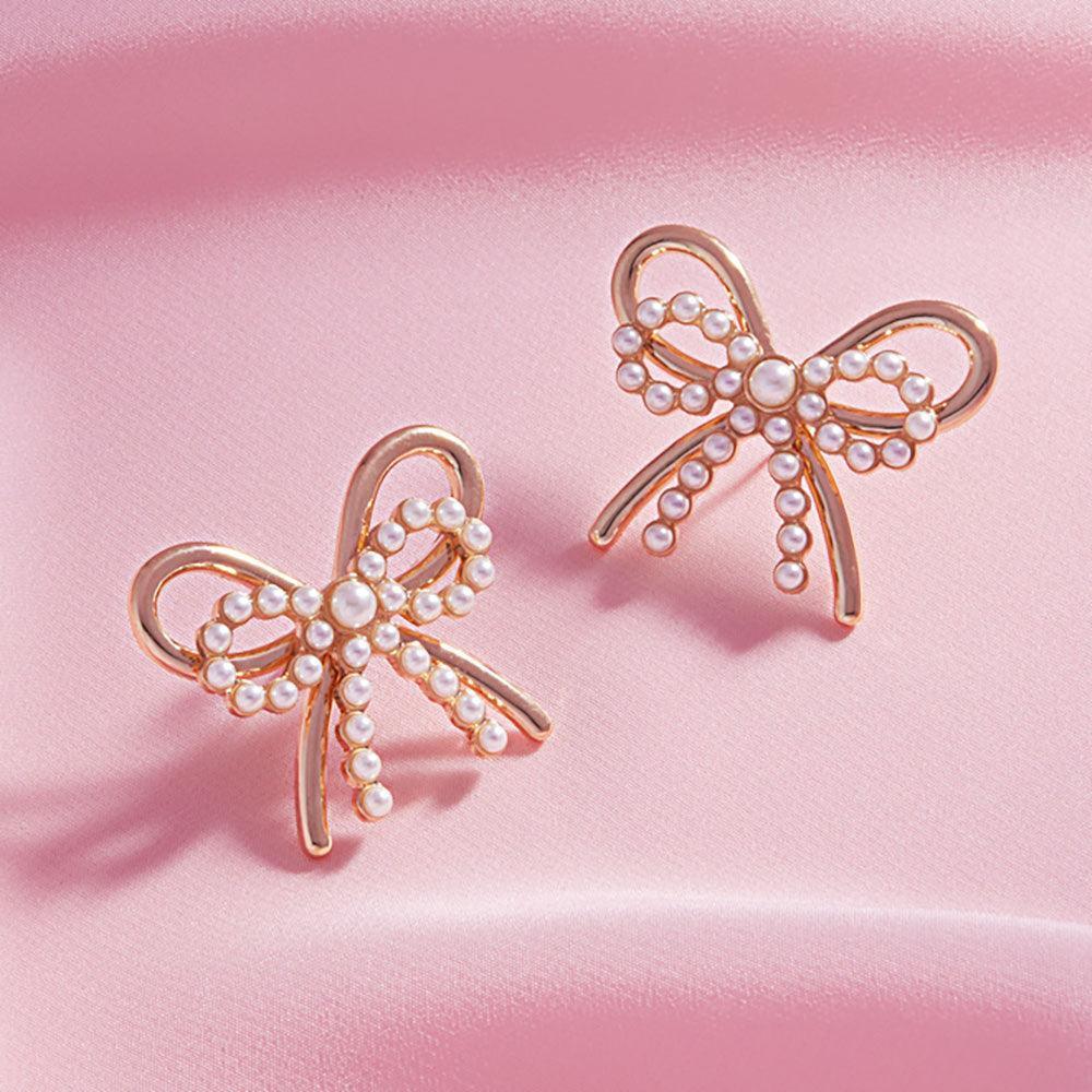 Cream Pearl Metal Bow Earrings - Jewelry Store by Erik Rayo