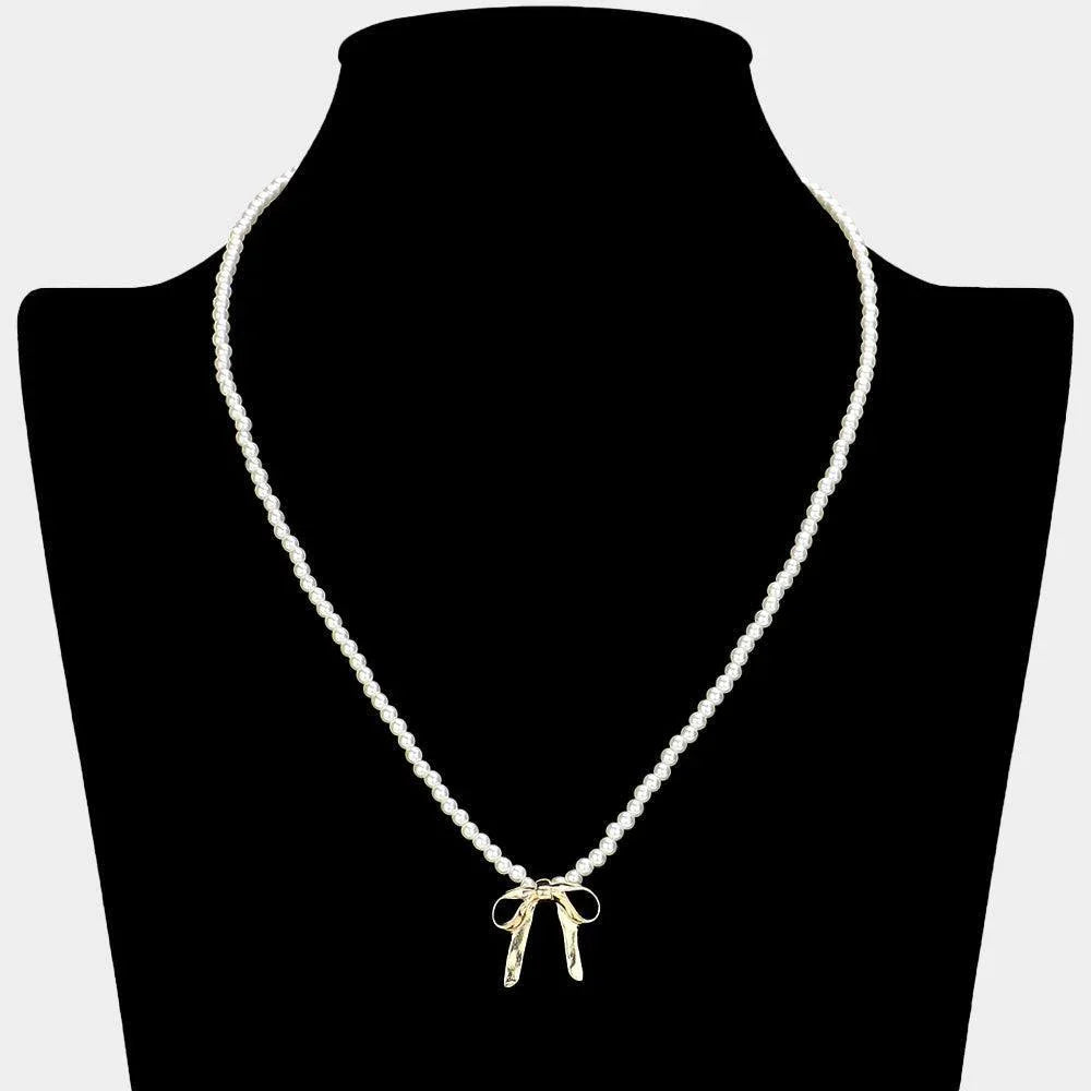 Cream Metal Bow Pendant Pearl Necklace - Jewelry Store by Erik Rayo