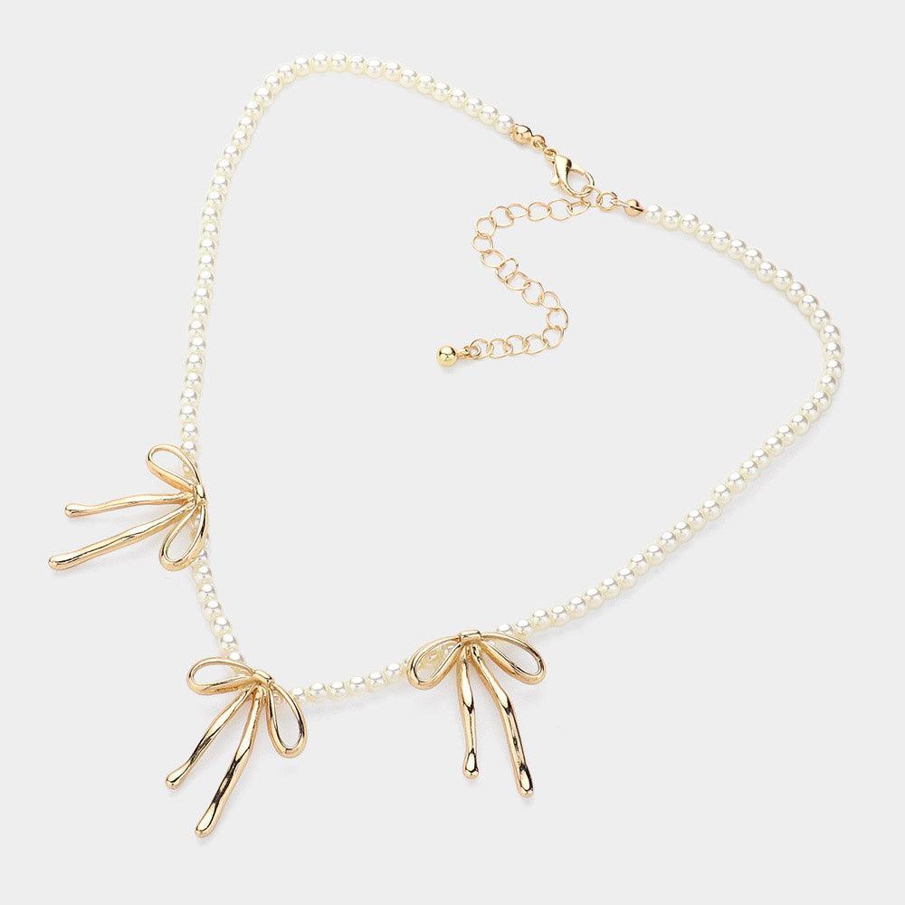 Gold Metal Bow Pendant Station Pearl Necklace - Jewelry Store by Erik Rayo