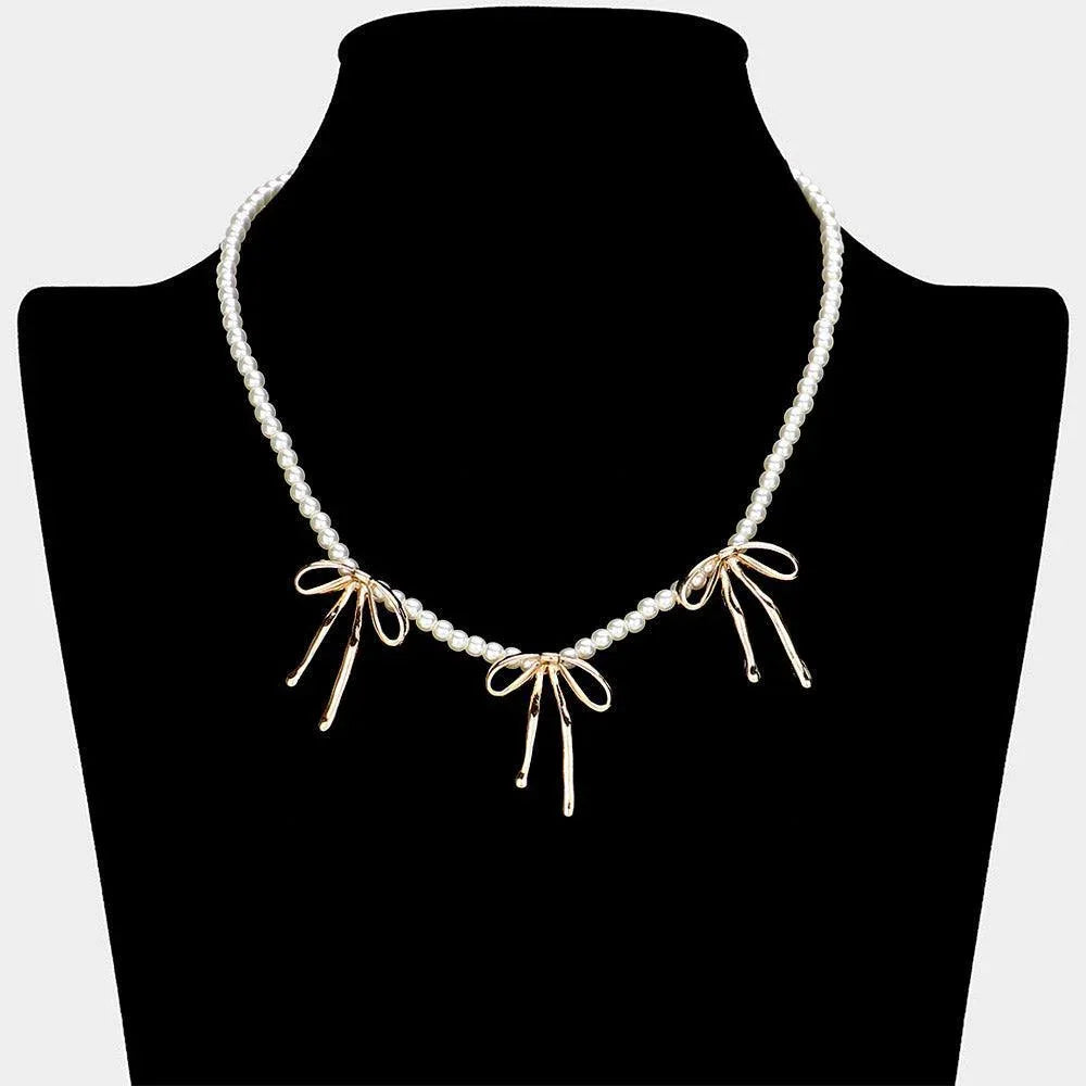 Gold Metal Bow Pendant Station Pearl Necklace - Jewelry Store by Erik Rayo