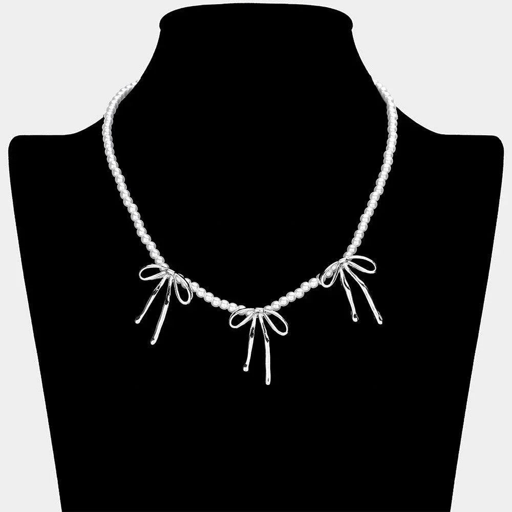 Metal Bow Pendant Station Pearl Necklace - Jewelry Store by Erik Rayo
