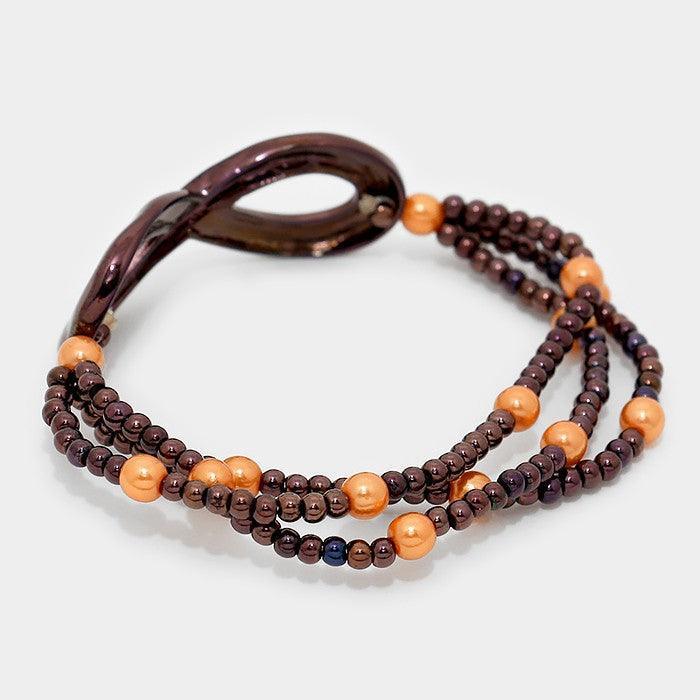 Peach Metal infinity beaded stretch bracelet - Jewelry Store by Erik Rayo