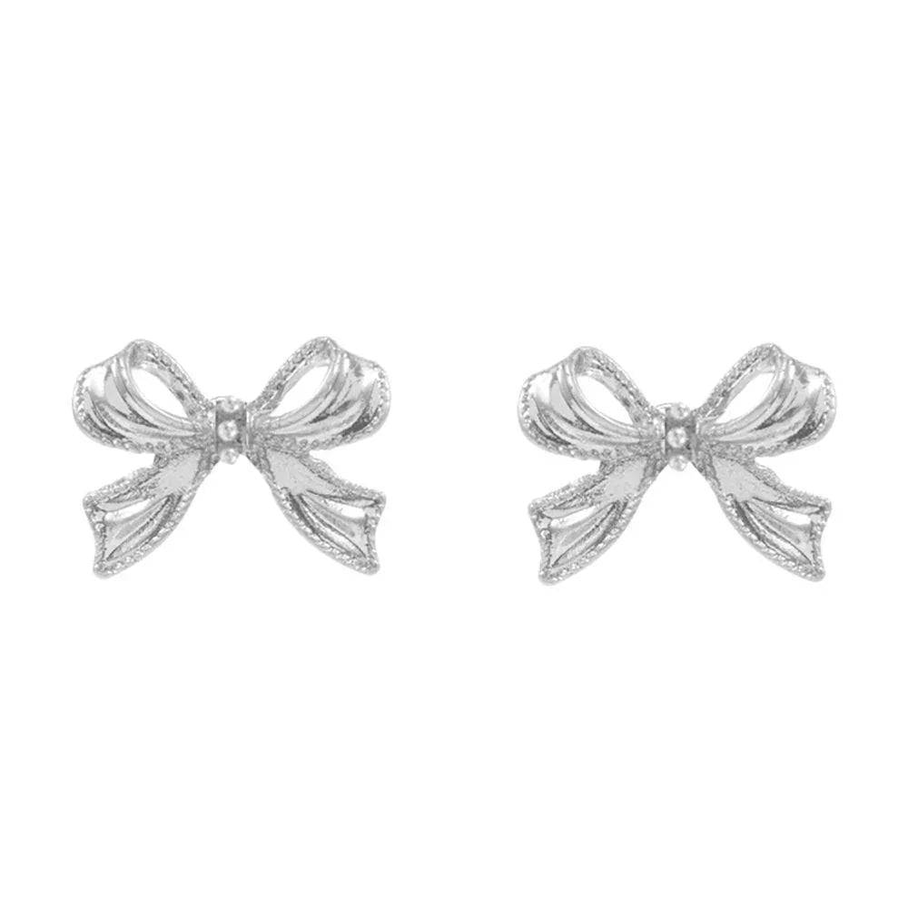 Silver Mini Pearl Pointed Textured Metal Bow Stud Earrings - Jewelry Store by Erik Rayo
